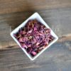 Organic red rose petals in a bowl